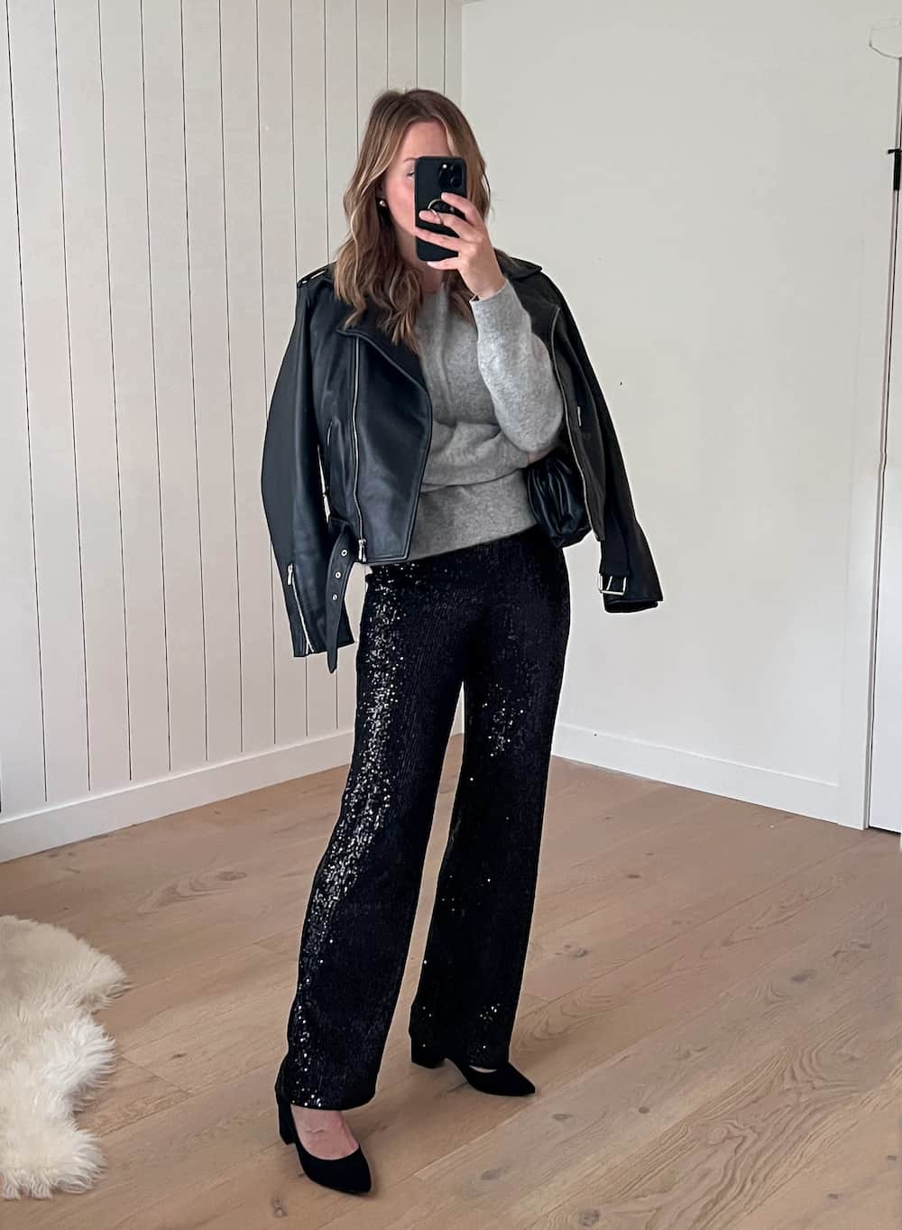 Black sequined wide-leg pants with gray crewneck sweater — New Years Outfit
