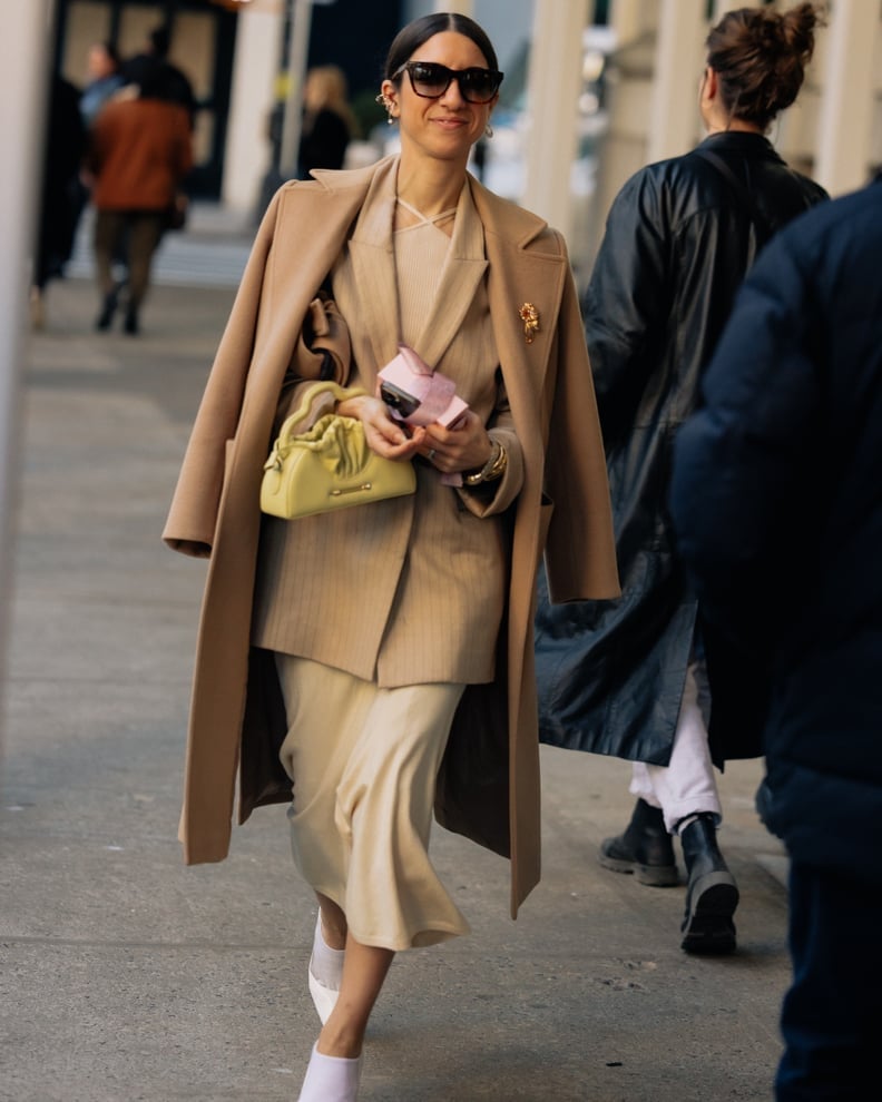 Camel Coat Over Pinstripe Blazer and Knit Top — New York Winter Outfit