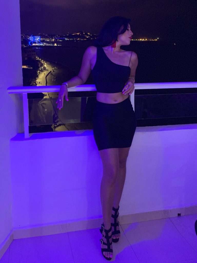 Black One-Shoulder Crop Top and Mini Skirt with Red Earrings — Night Club Outfit