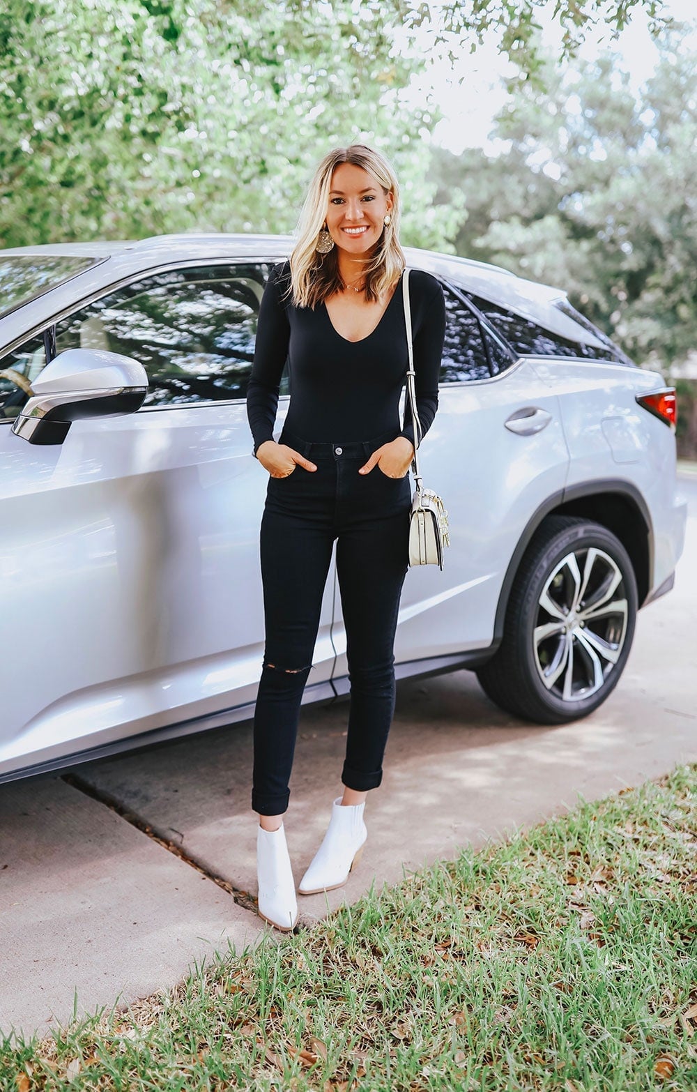 Black V-Neck Top with Distressed Black Jeans and White Boots — Night Out Outfits