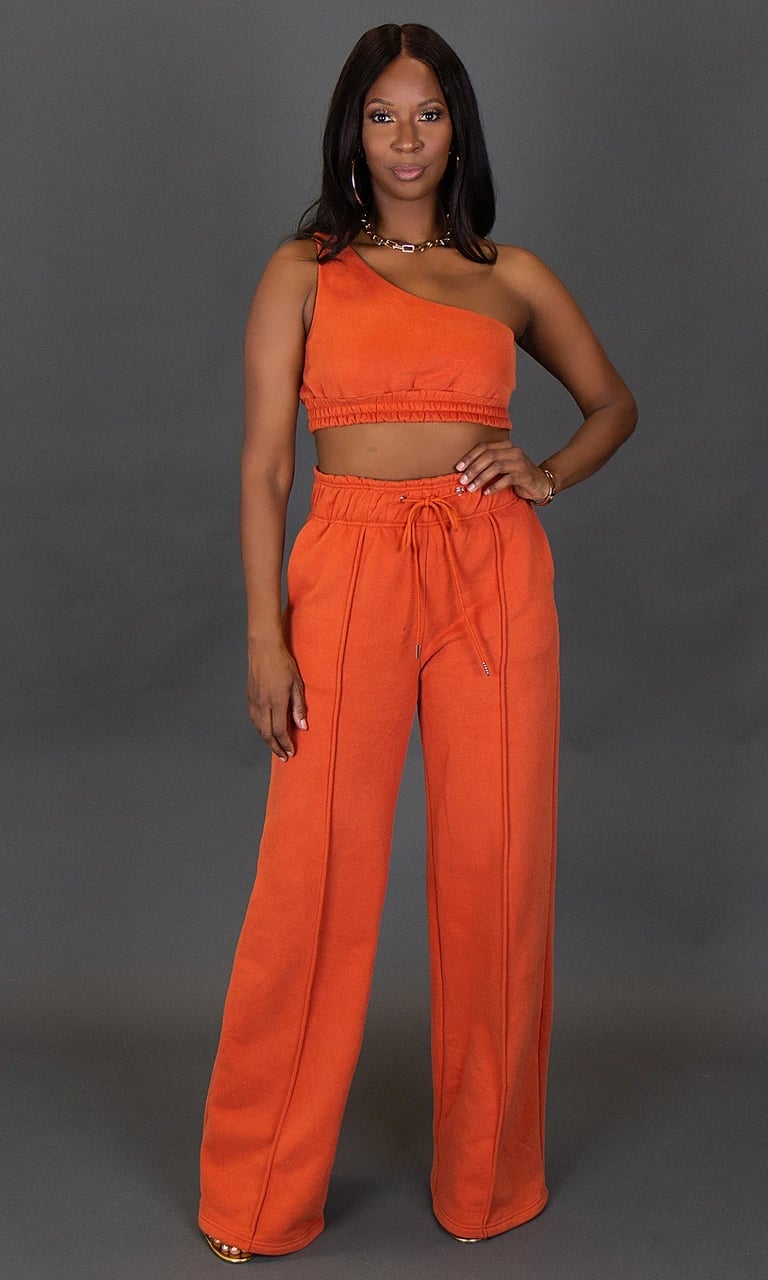 Burnt Orange Sweatpants With One-Shoulder Crop Top — Orange Pants Outfits