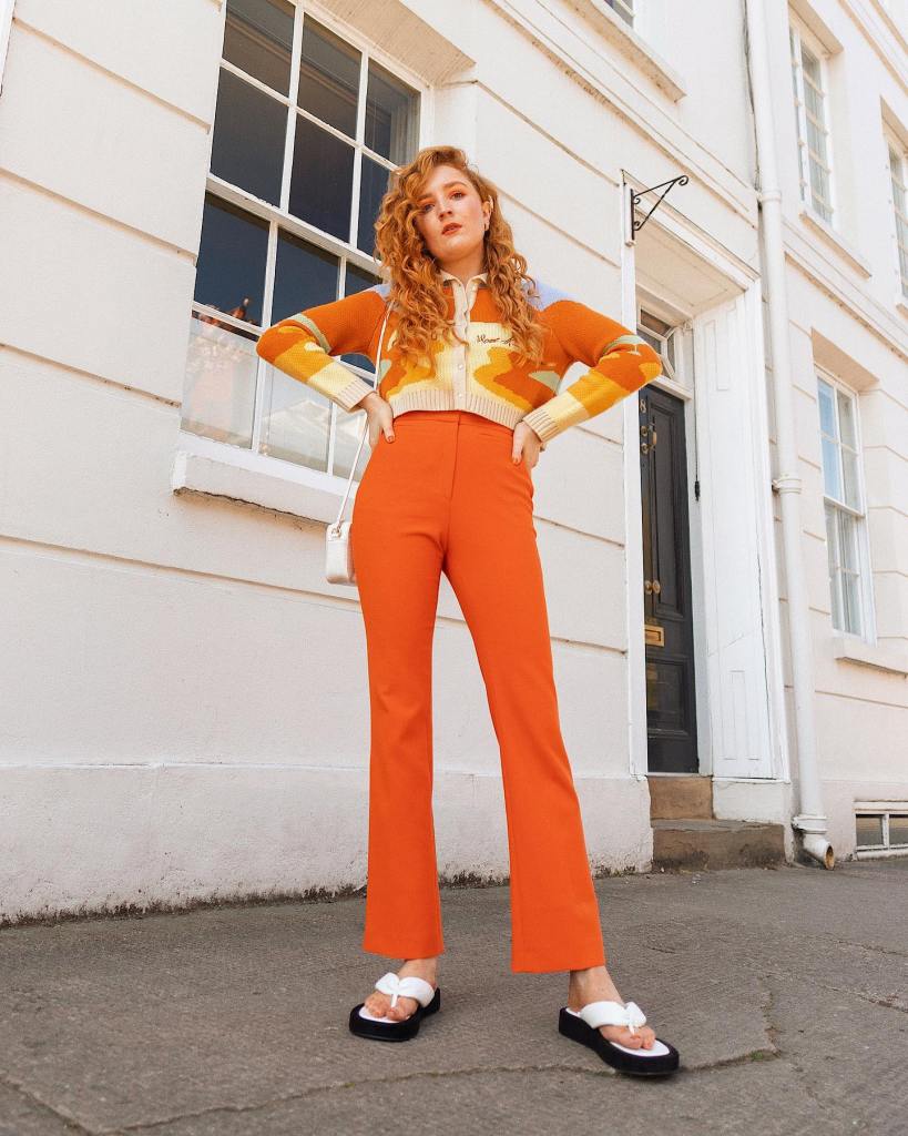 Bright Orange Straight-Leg Pants With Graphic Cardigan — Orange Pants Outfits