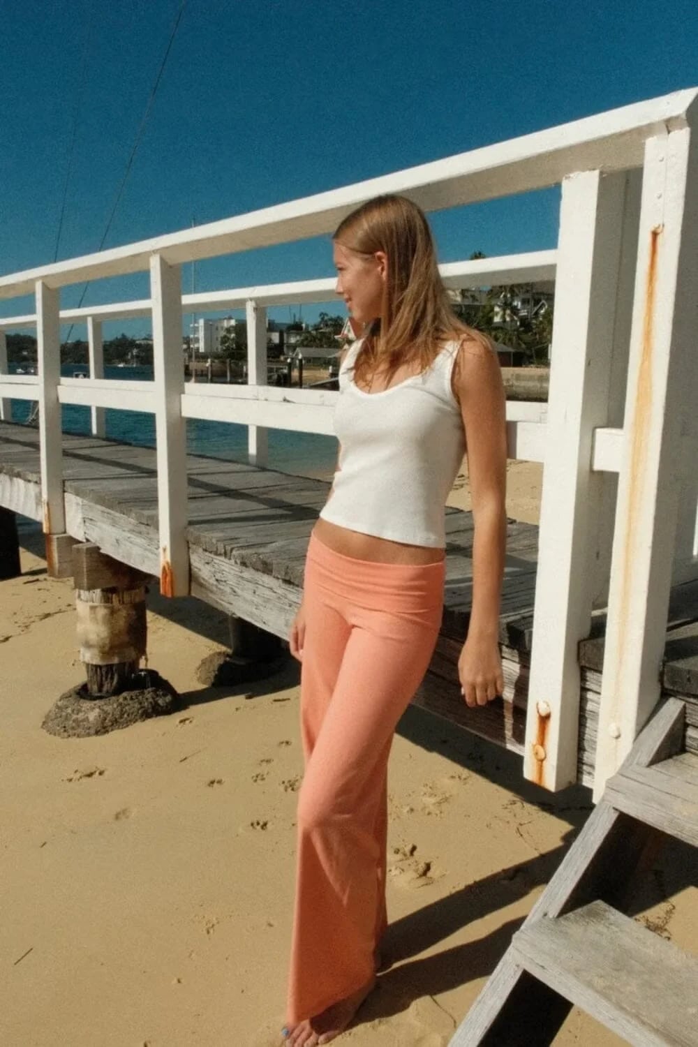 Peach Wide-Leg Pants With White Tank Top and Soft Jersey Knit — Orange Pants Outfits