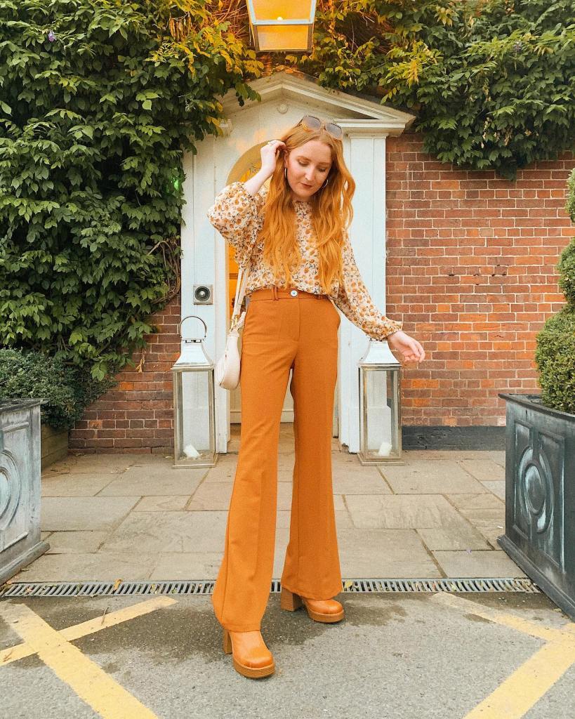 Brown Orange Flared Trousers With Floral Blouse — Orange Pants Outfits