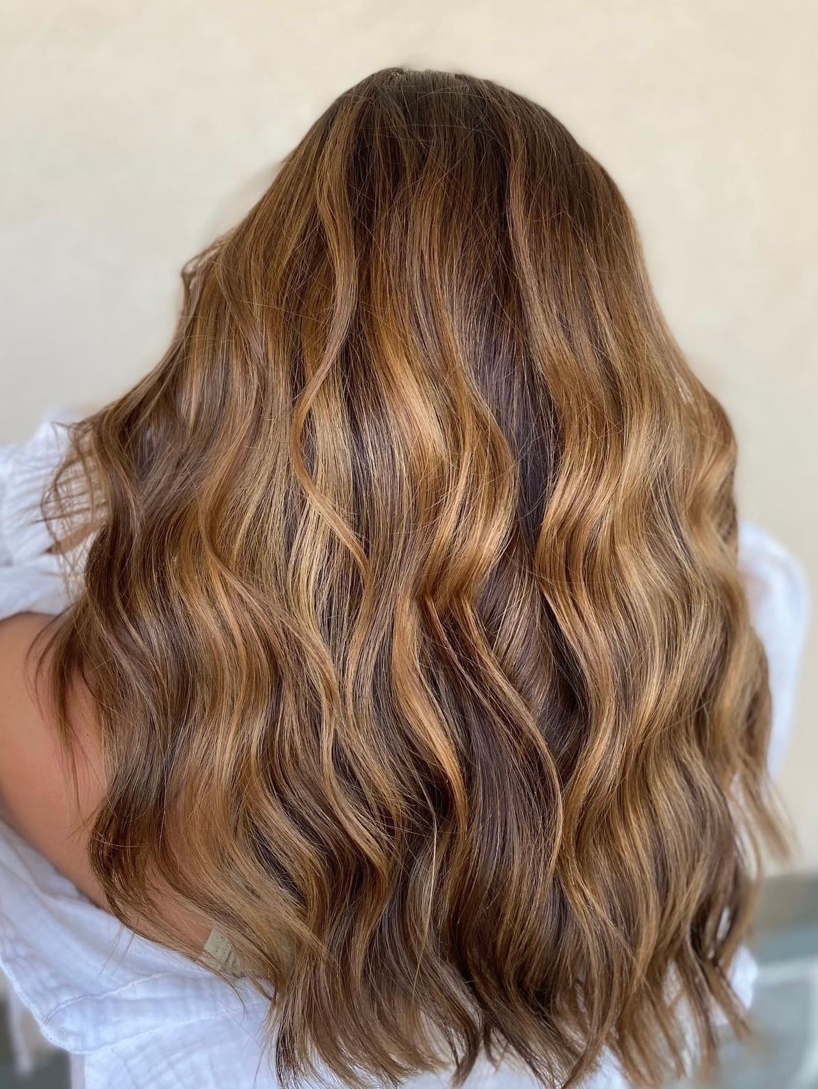 Dark Blonde With Lighter Blonde Partial Highlights and Wavy Blowout