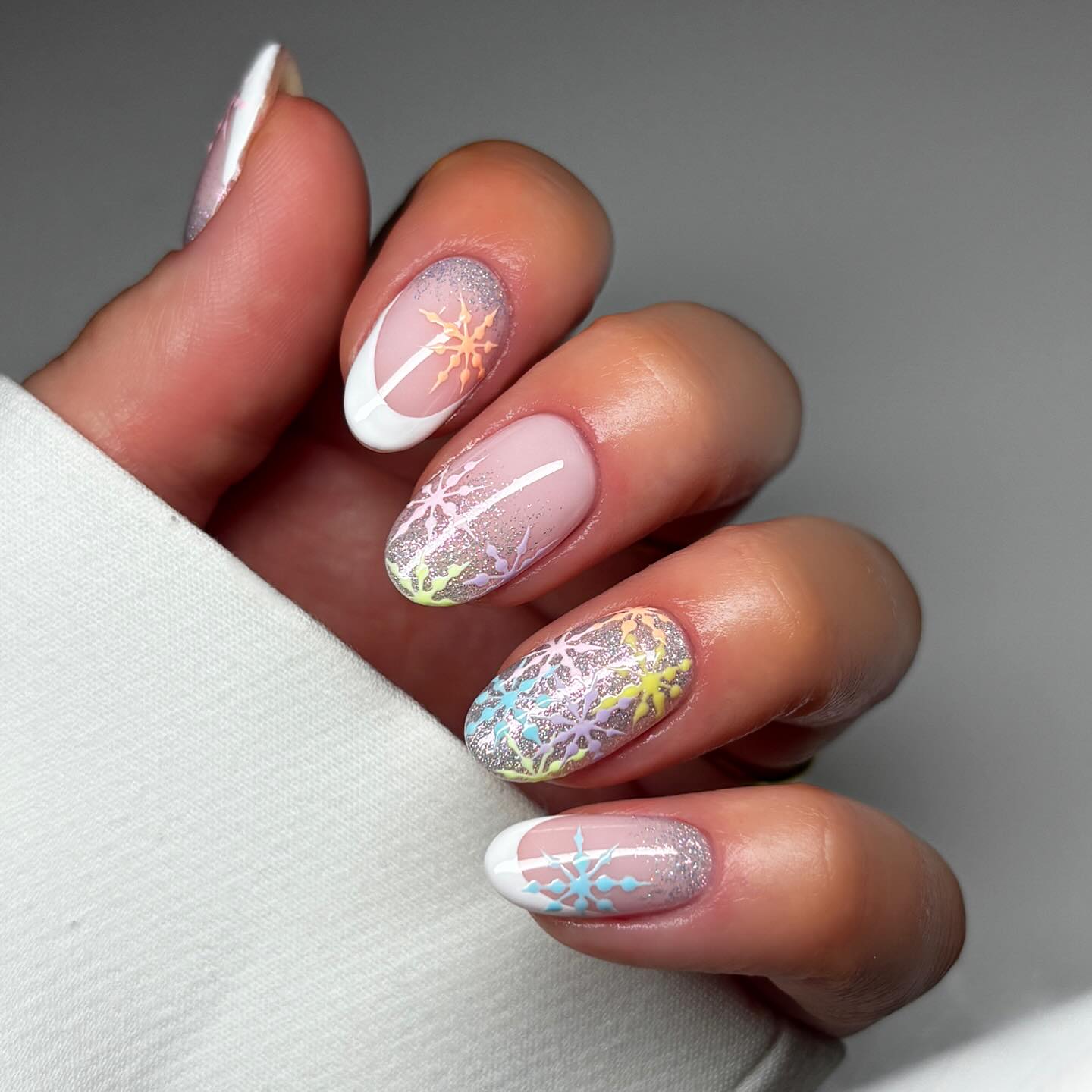 Pastel Snowflake French Tip Oval Nails