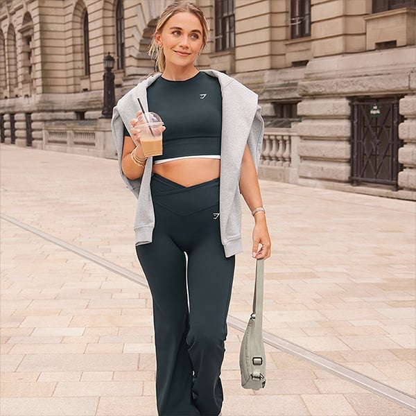 Dark Green Flare Leggings With a Cropped Sweatshirt Layer — Pilates Outfits