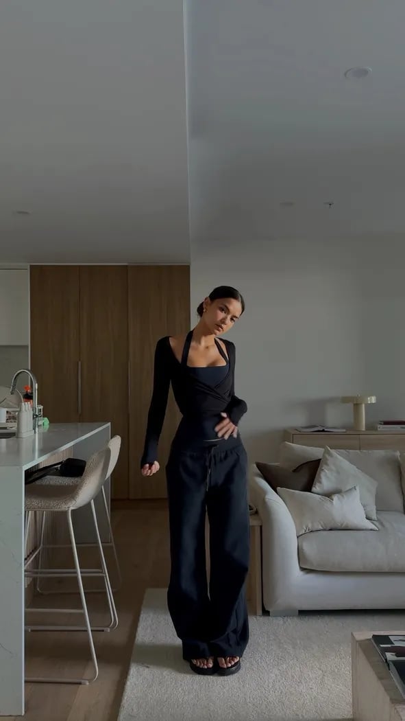 Monochromatic Black Athleisure With Layered Tops — Pilates Outfits