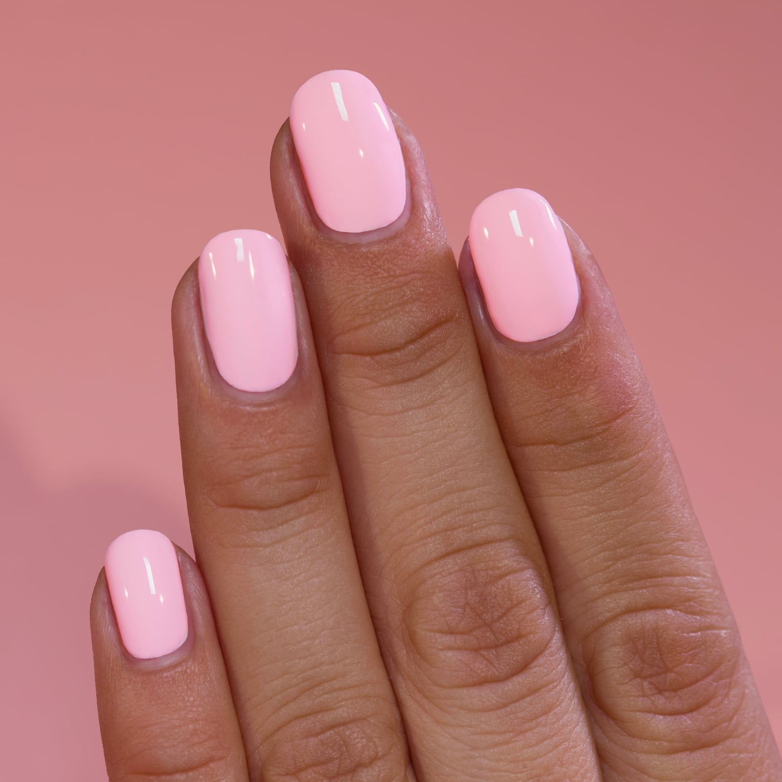Short Oval Nails In Vibrant Pastel Pink, Close-Up Take — Pink Nail Colors