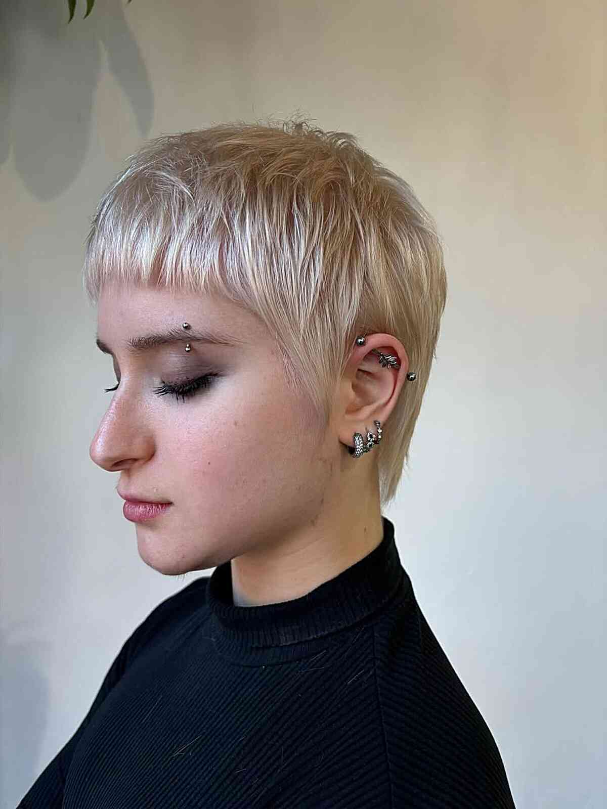 Textured Platinum Blonde Pixie With Micro Bangs Textured Platinum Blonde Pixie With Micro Bangs