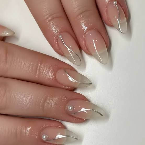 Sheer Nude Almond Nails With Pearls, Glossy, Close-Up Take Sheer Nude Almond Nails With Pearls, Glossy, Close-Up Take — Professional Nails