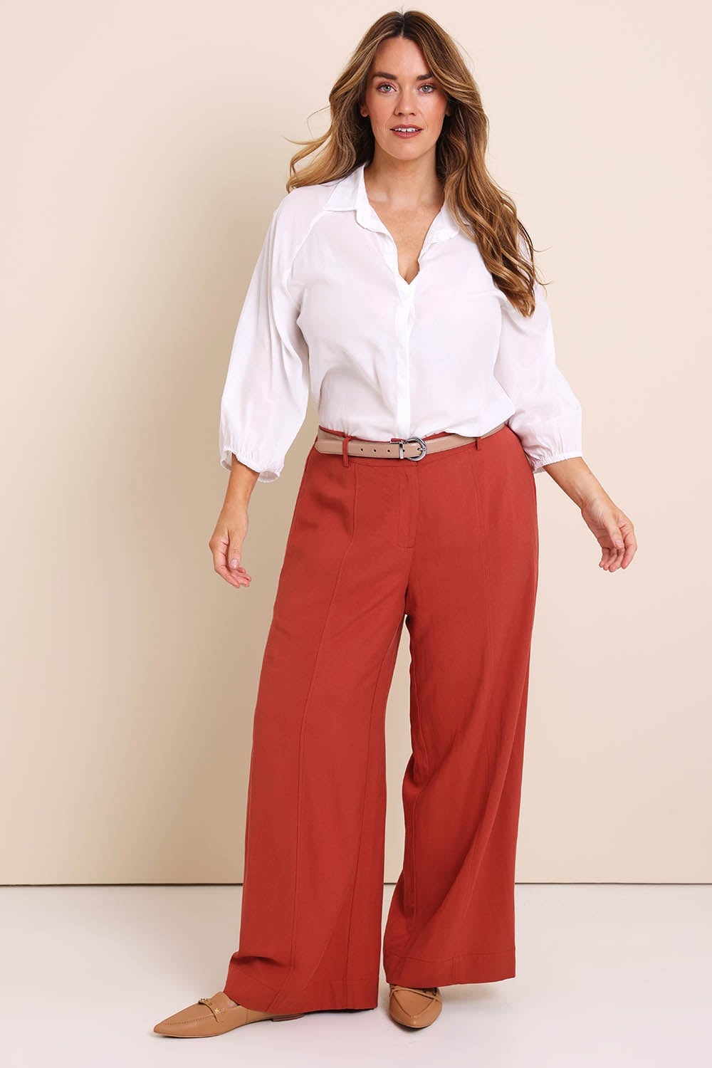 White Button-Down Shirt with Rust Orange Wide-Leg Trousers — Professional Outfits