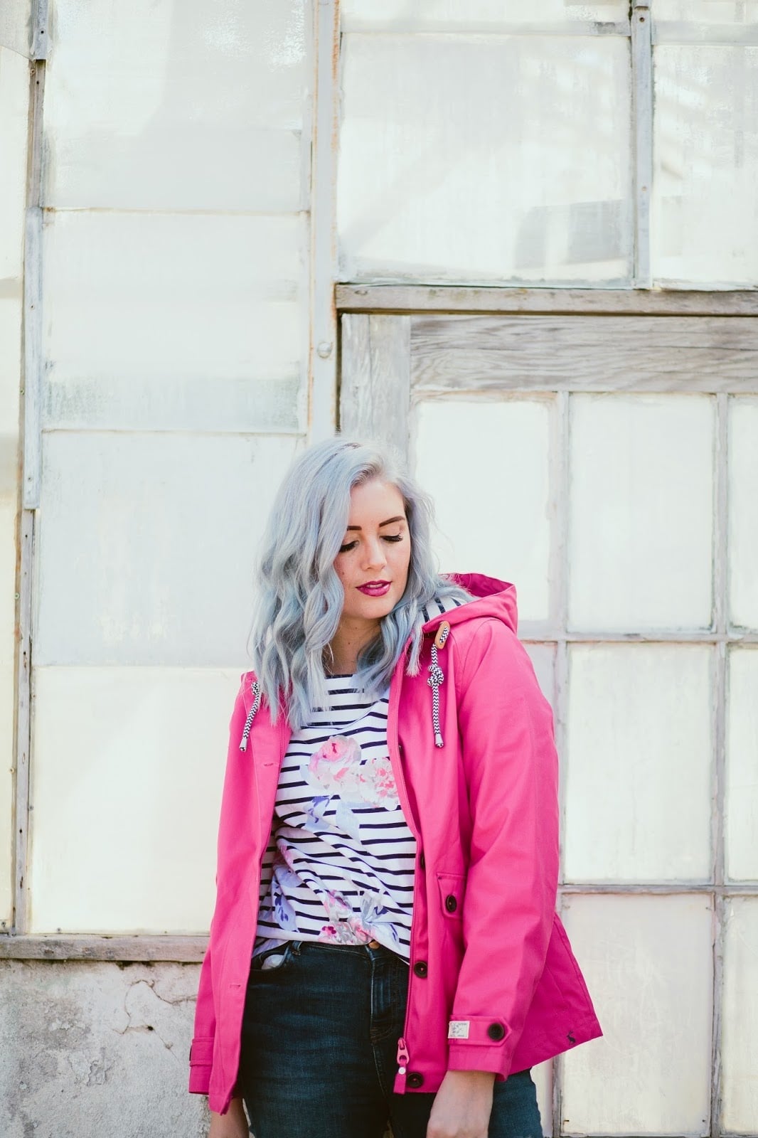 Bright Pink Rain Jacket Over Black and White Striped, Close-Up Take — Rain Jacket Outfits