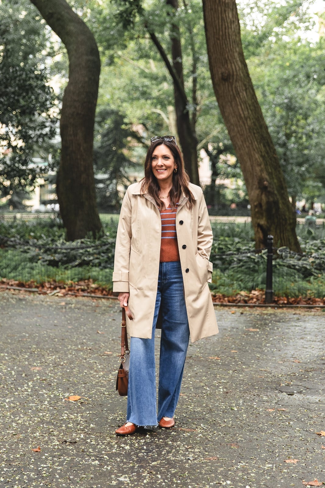 Beige Trench Coat with Striped Top and Wide-Leg Jeans — Rain Jacket Outfits