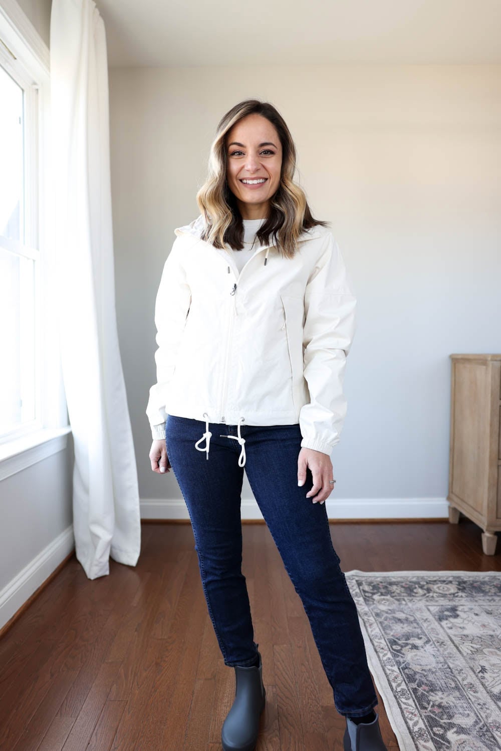 White Hooded Jacket Over White Top with Gray Rain Boots — Rain Jacket Outfits