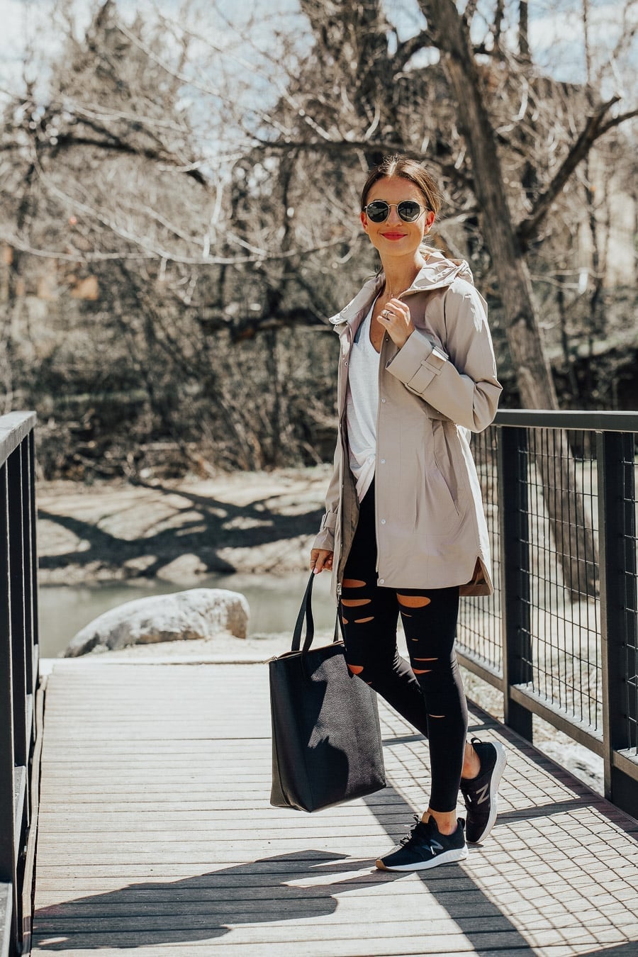Beige Rain Jacket Over White Tank Top with Ripped Black Jeans — Rain Jacket Outfits