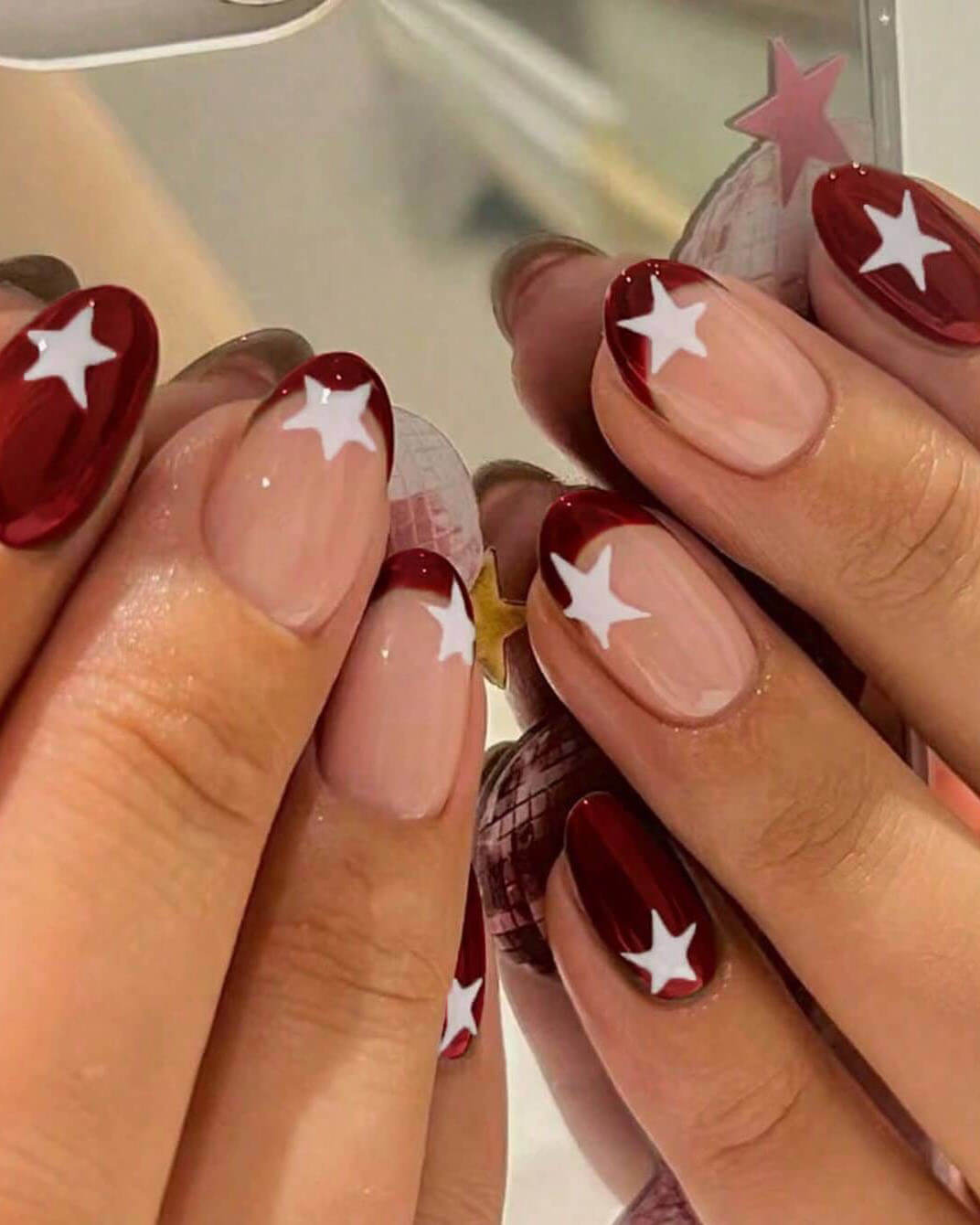 Medium Oval Sheer Nude With Red French Stars Medium Oval Sheer Nude With Red French Stars — Red and White Nails