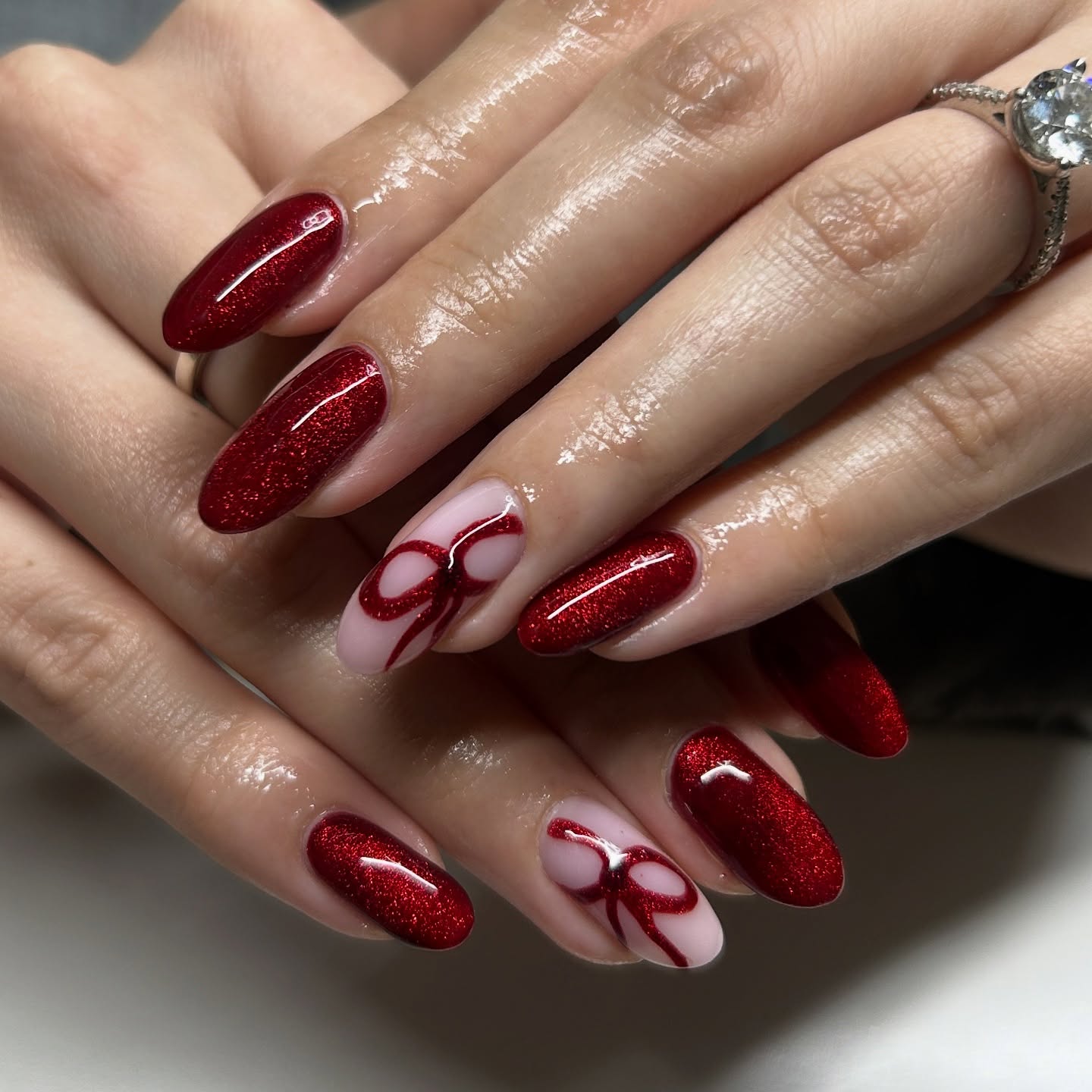 Red Glitter Bow Accent Almond Nails