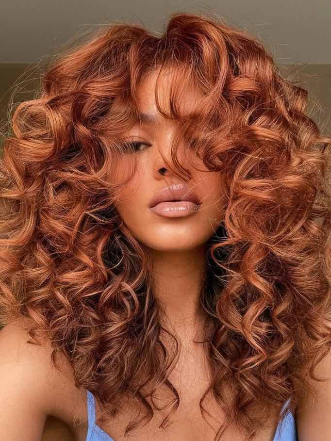 Voluminous Auburn Curls With Curtain Bangs — Red Hair Black Women