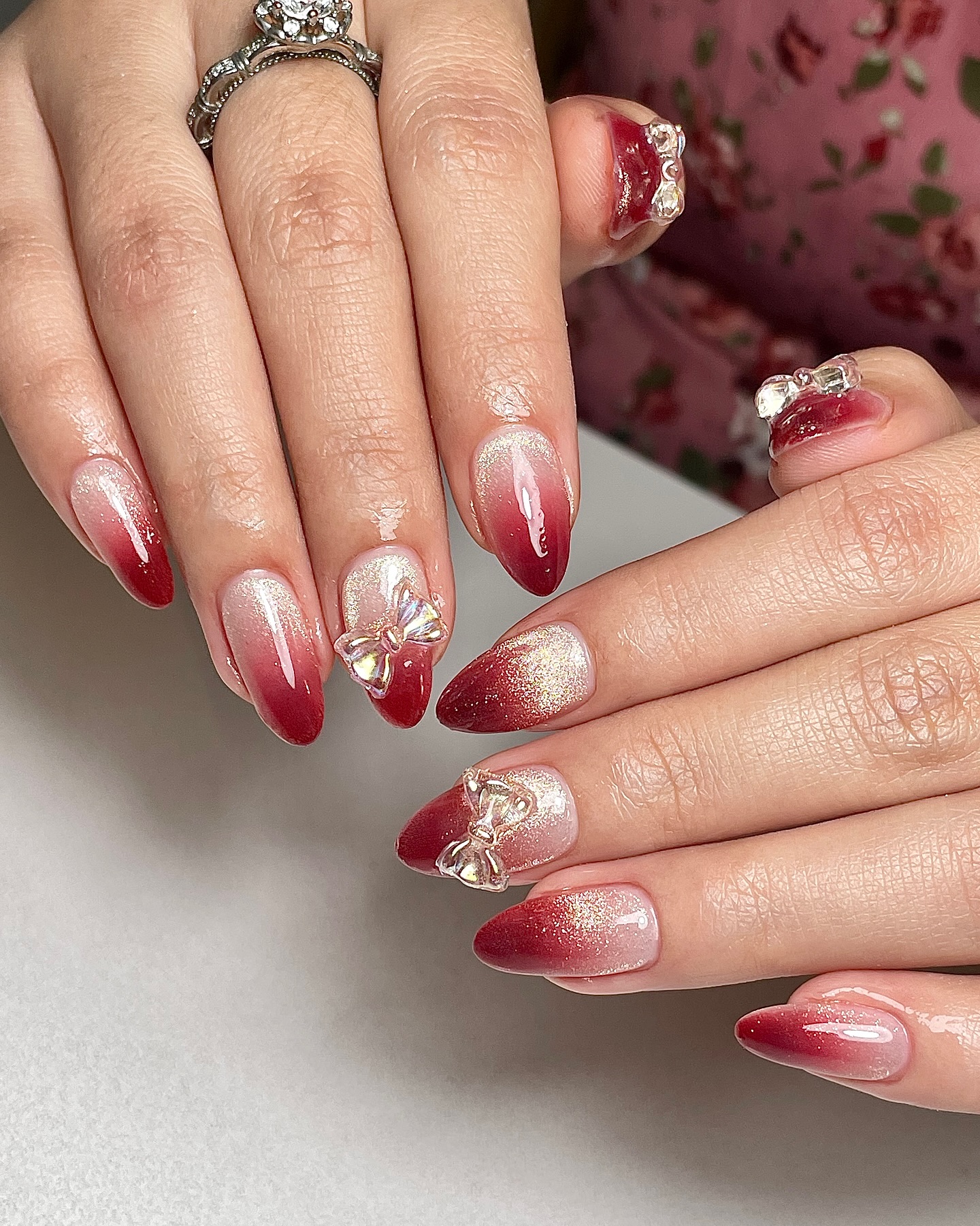 Red Ombre Almond Nails with Rhinestone Bows