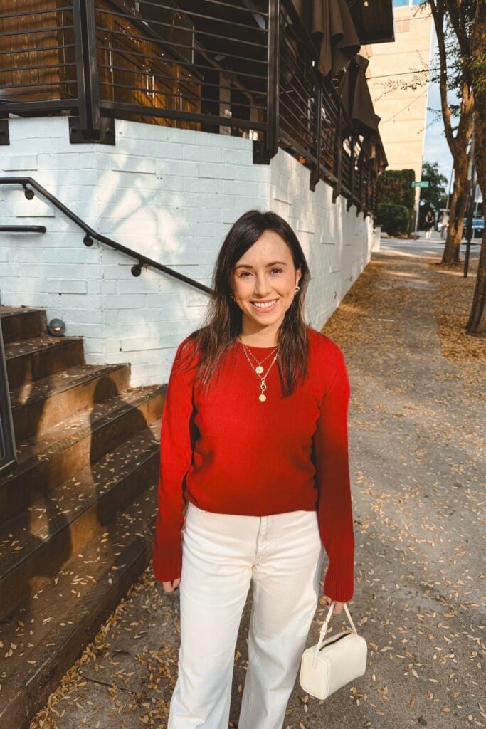 Red Crewneck Sweater With Cream Wide Leg Trousers, Close-Up Take Red Crewneck Sweater With Cream Wide Leg Trousers, Close-Up Take — Red Sweater Outfit