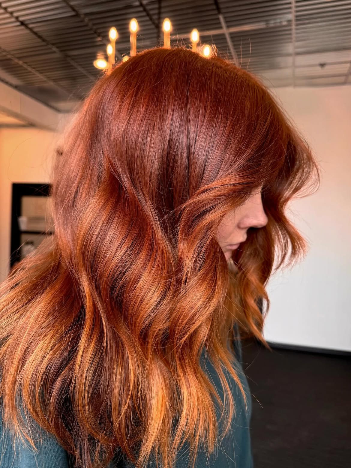 Rich Copper Waves With Soft Curtain Bangs