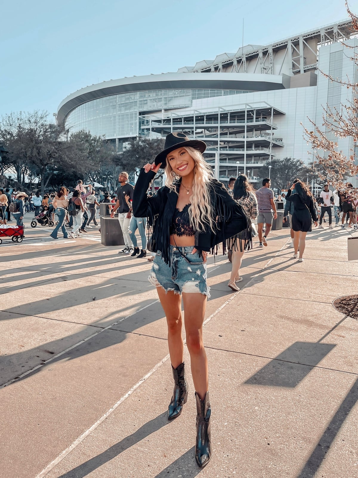 Fringed Vest Over Plaid Shirt With Flared Jeans Fringed Vest Over Plaid Shirt With Flared Jeans — Rodeo Outfits for Women