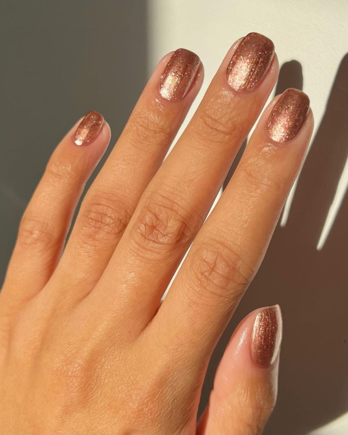 Short Oval Shimmering Rose Gold Nails Short Oval Shimmering Rose Gold Nails