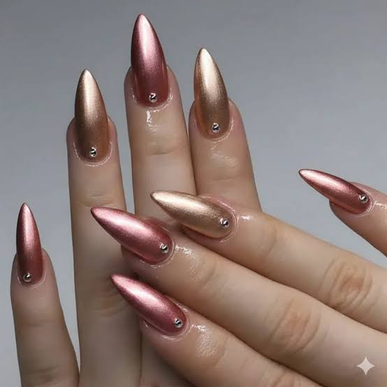 Long Stiletto Rose Gold Gold Chrome Studs, Close-Up Take Long Stiletto Rose Gold Gold Chrome Studs, Close-Up Take — Rose Gold Nails