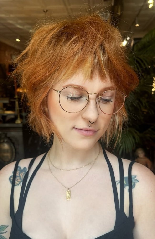 Chin Length Warm Copper Shaggy Bob With Wispy Bangs