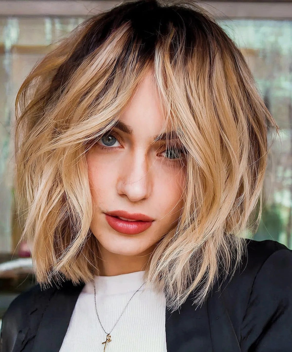 Collarbone Blonde Shaggy Bob With Curtain Bangs