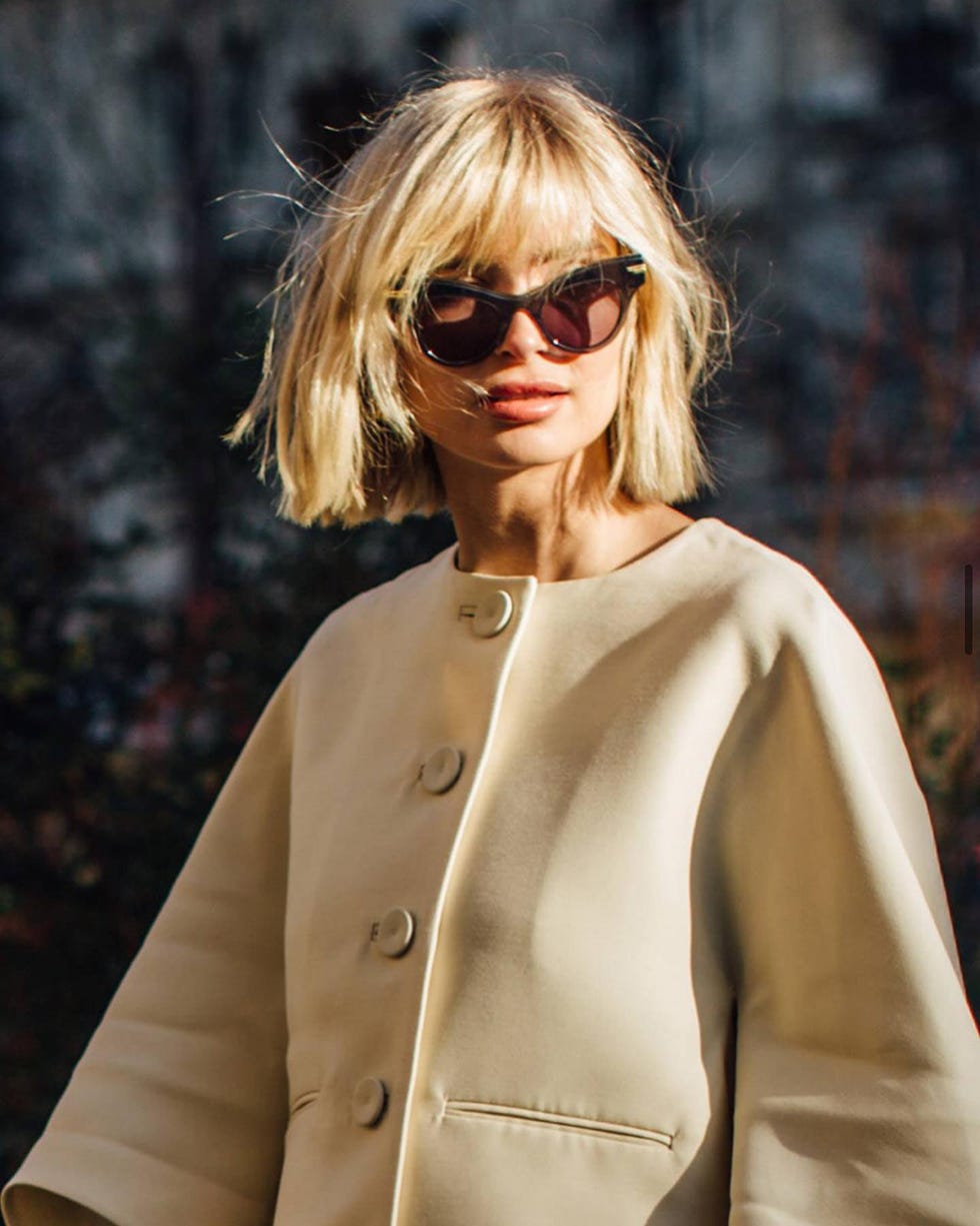 Chin Length Blonde Shaggy Bob With Curtain Bangs