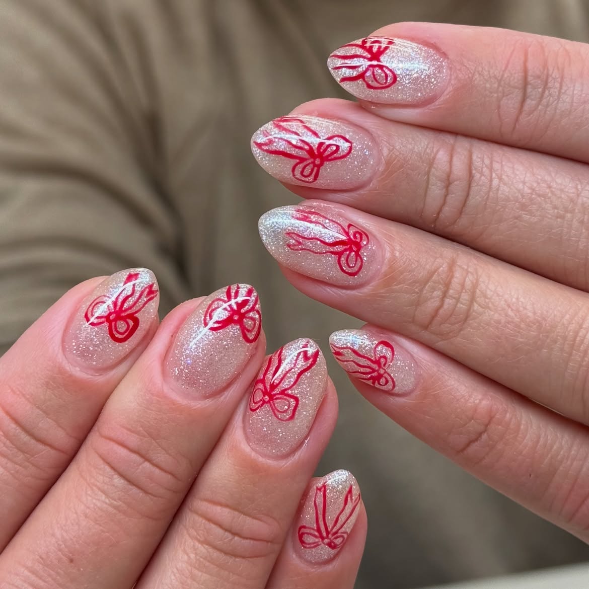 Sheer Glitter Base with Red Bow Accents