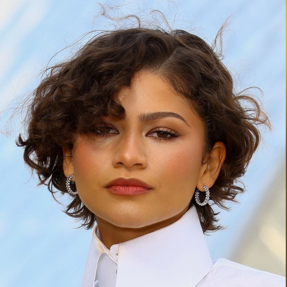 Chin Length Curly Bob With Wispy Bangs — Short Bob Hairstyles