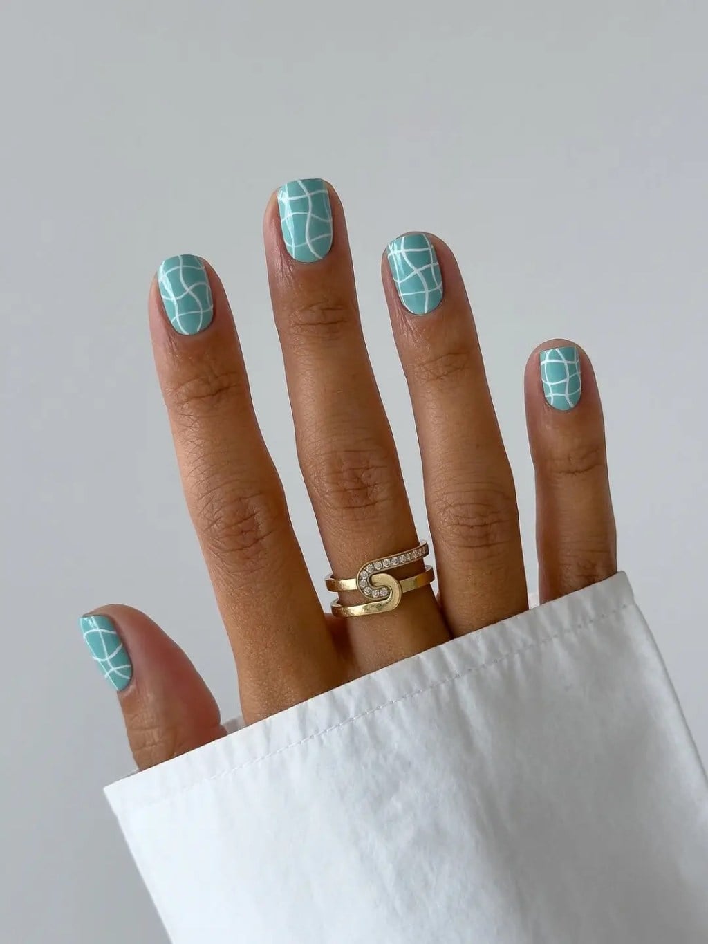 Turquoise Short Oval Nails With White Geometric Pattern — Short Cute Nails