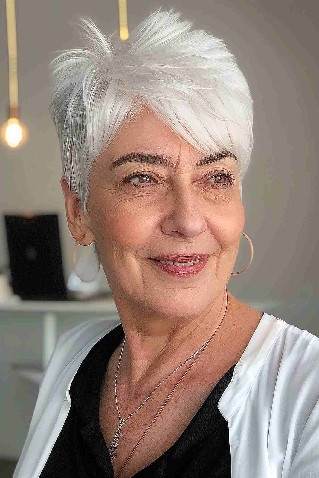 White Blonde Pixie With Volume and Side-Swept Bangs White Blonde Pixie With Volume and Side-Swept Bangs — Short Hair Hairstyles