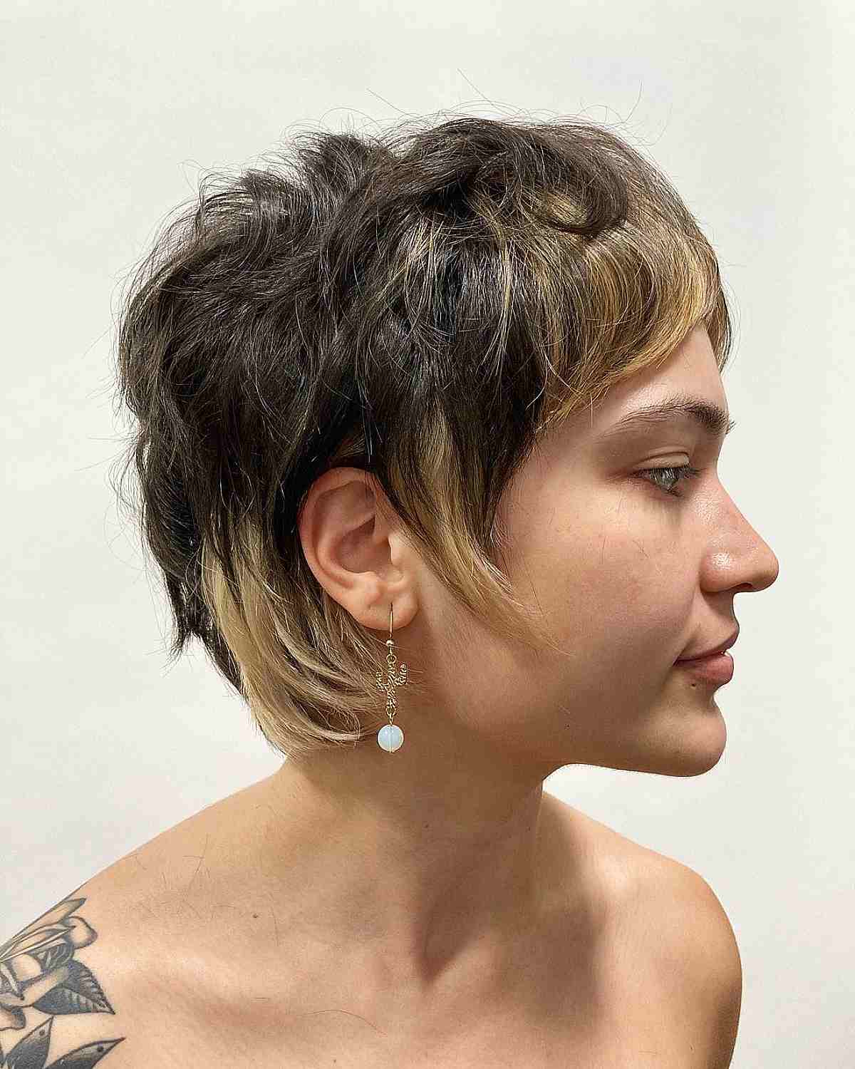 Ear Length Shag With Pixie Layers And Blonde Highlights — Short Shag Haircuts
