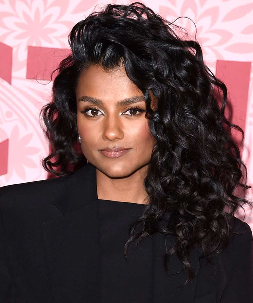 Collarbone Curls With Curtain Bangs — Side Part