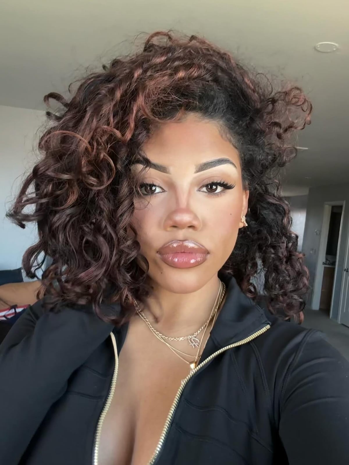 Shoulder Length Defined Curls With Auburn Highlights — Side Part Hairstyles