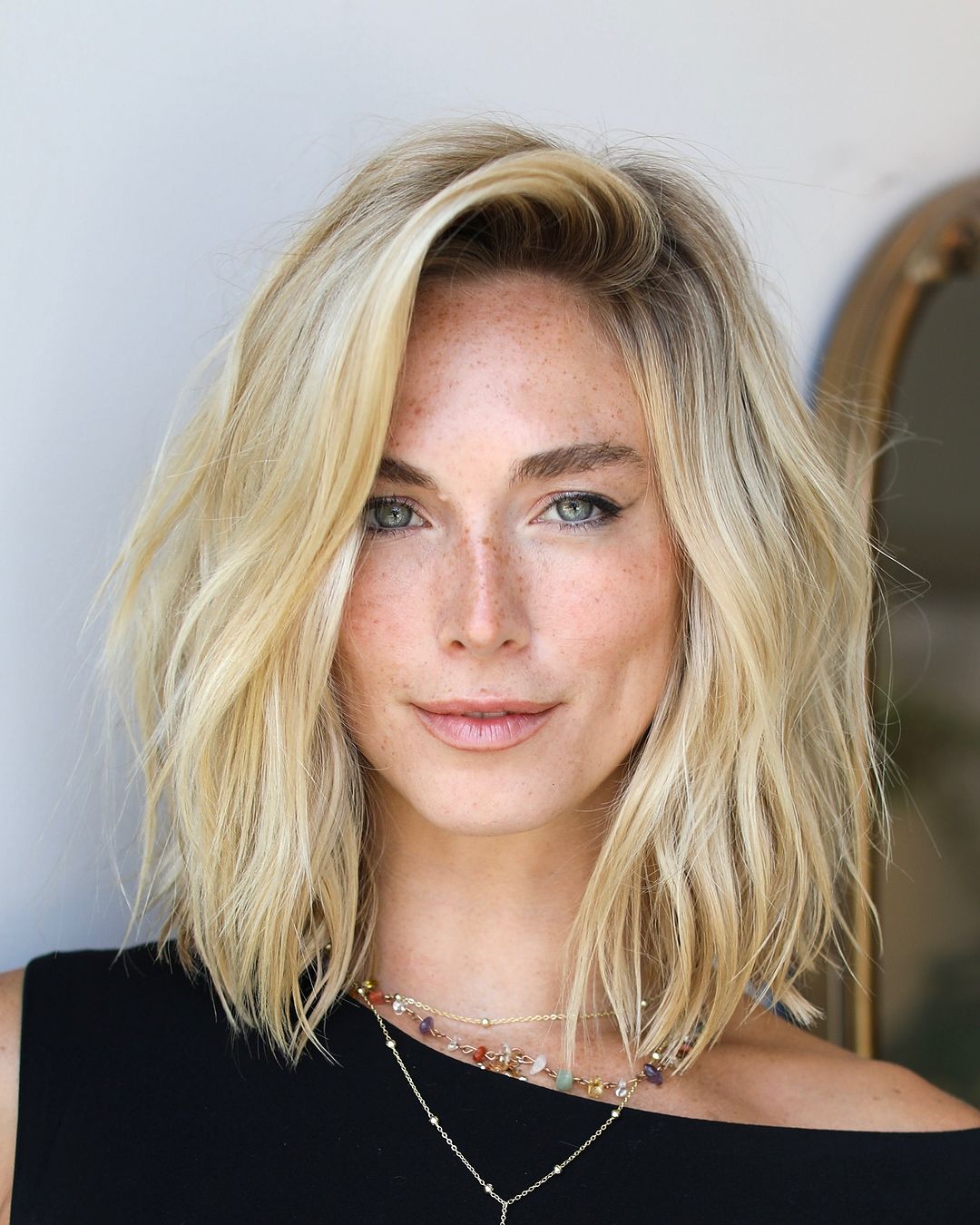 Chin Length Platinum Bob With Textured Ends — Side Part Hairstyles