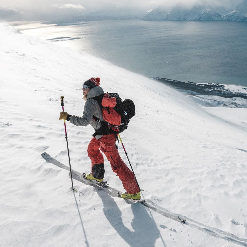 Red ski pants with gray hooded jacket — Skiing Outfit