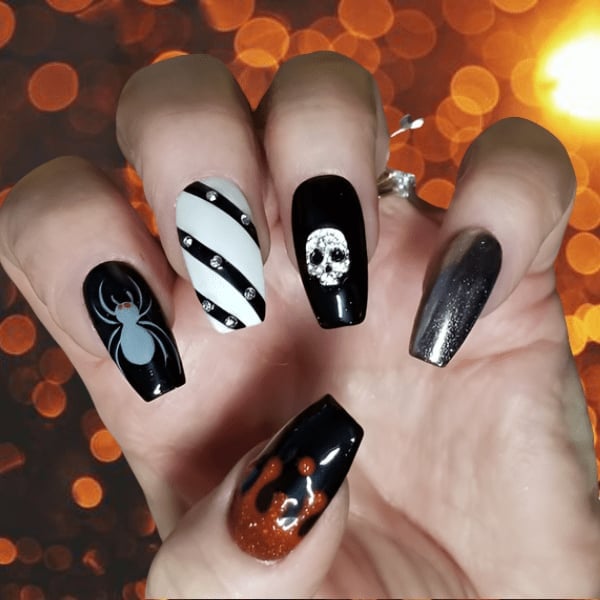 Long Stiletto Glossy Black Rhinestone Skull Nails Long Stiletto Glossy Black Rhinestone Skull Nails