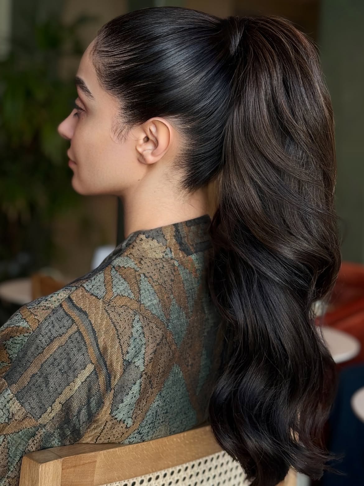Sleek High Ponytail With Voluminous Waves
