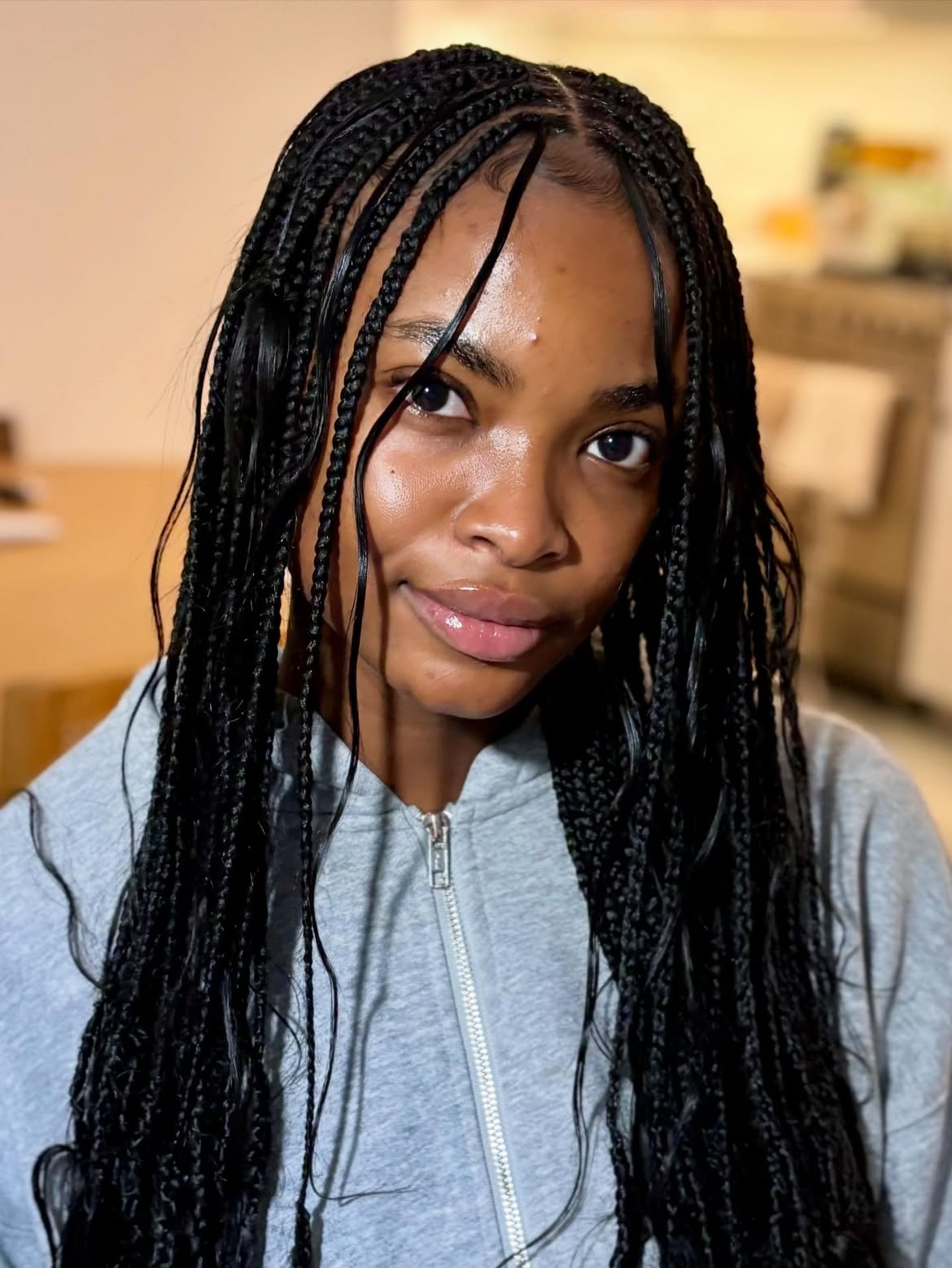 Sleek Knotless Braids With Wavy Face Framing Strands
