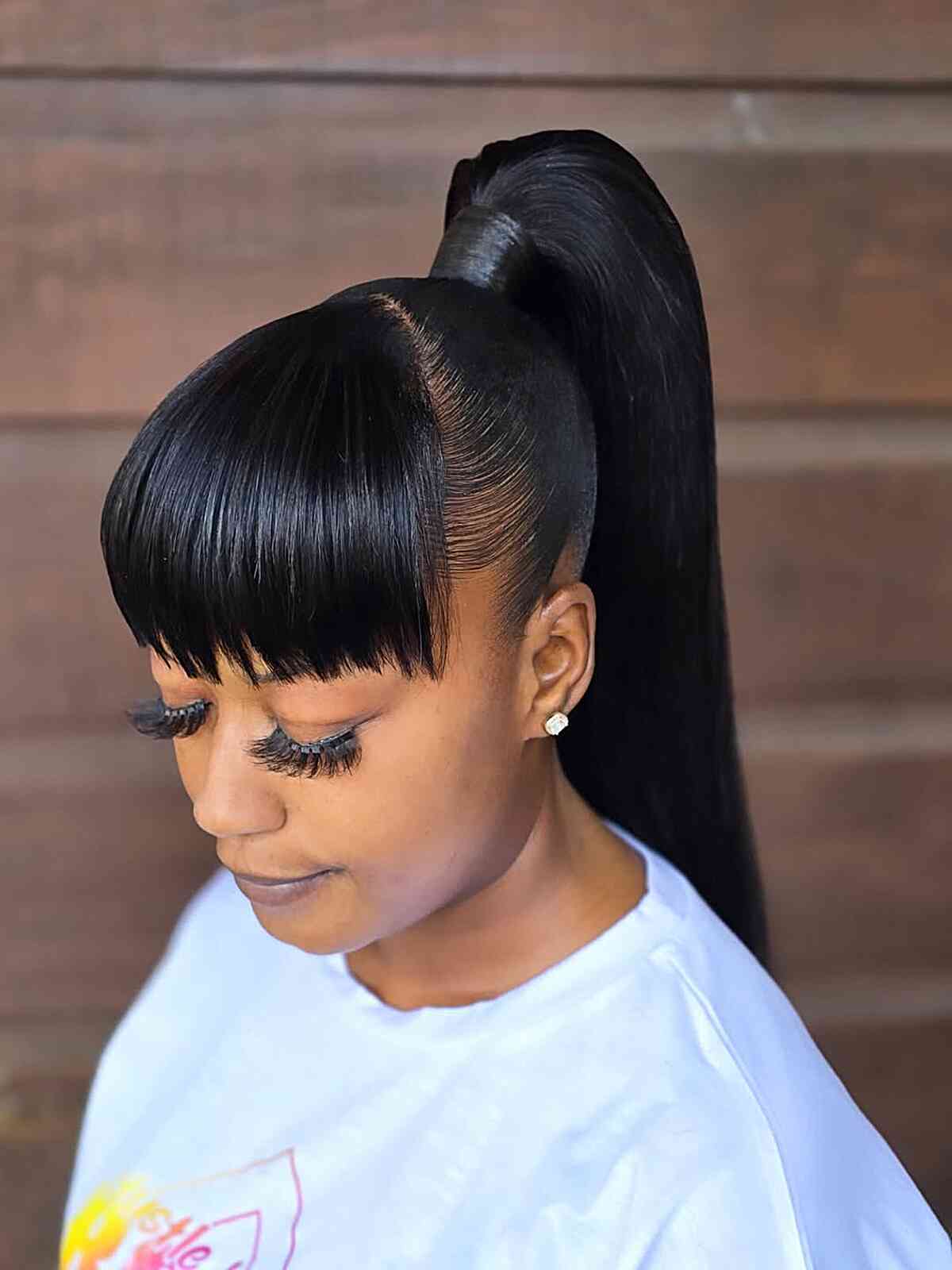 High Ponytail With Blunt Bangs — Sleek Ponytail