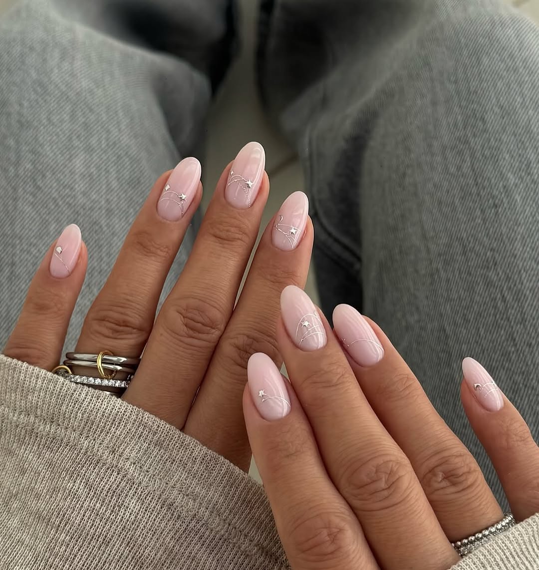 Soft Pink Oval Nails with Silver Star Constellations