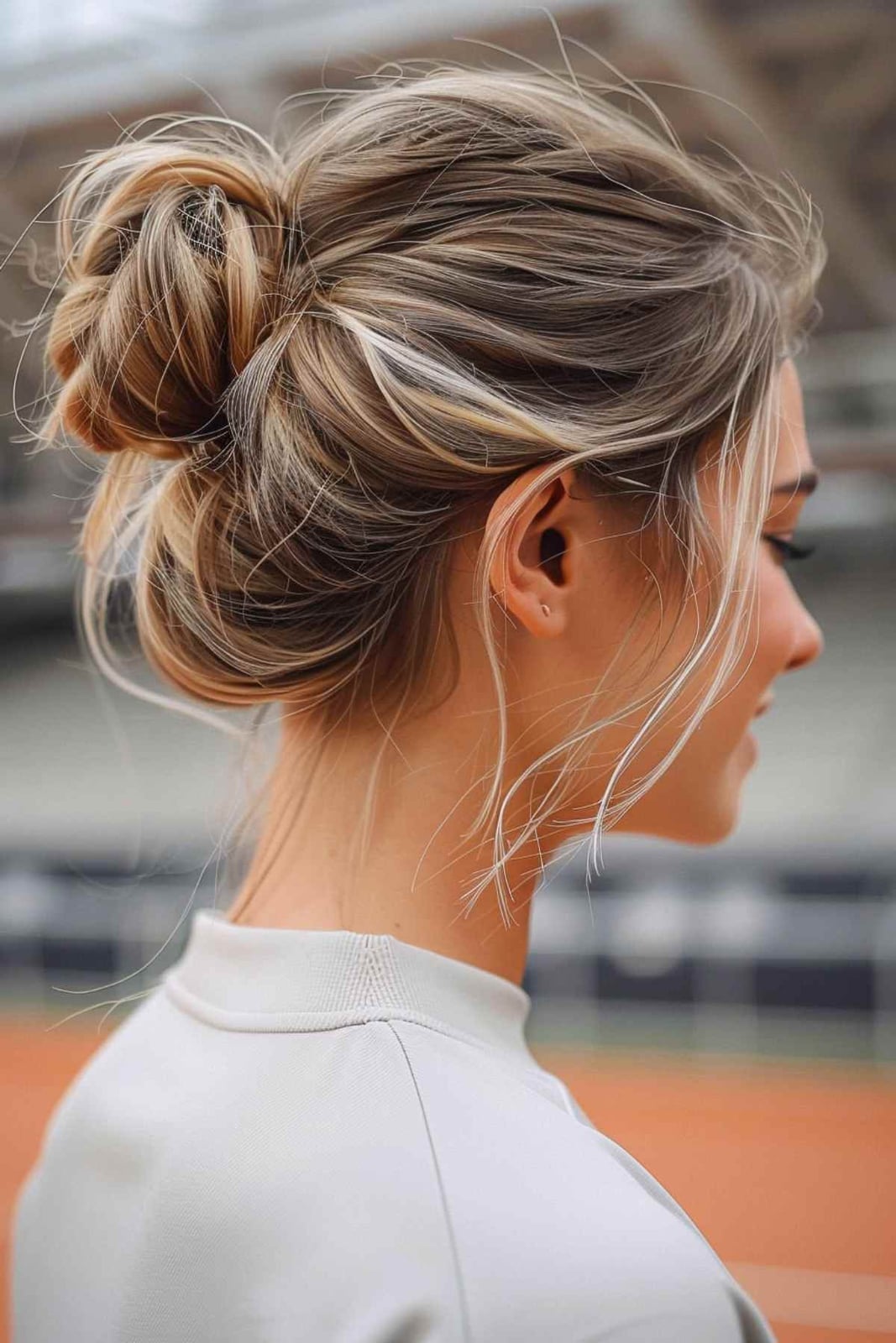 Messy Bun With Wispy Face-Framing Bangs — Softball Hair