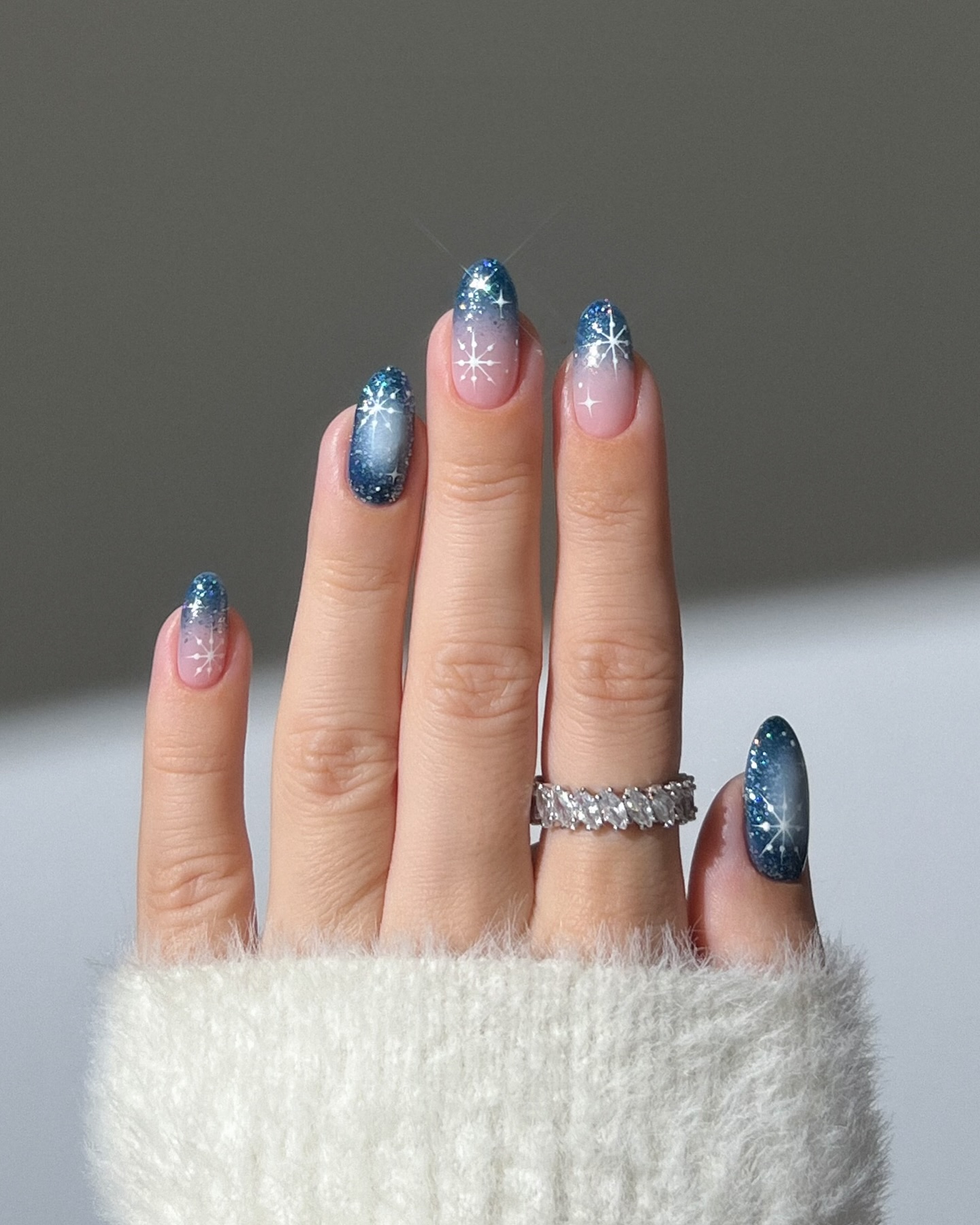 Sparkling Blue Ombre Snowflake Almond Nails