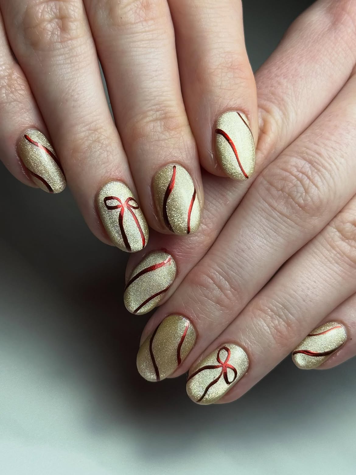 Sparkling Gold and Red Christmas Bow Nails
