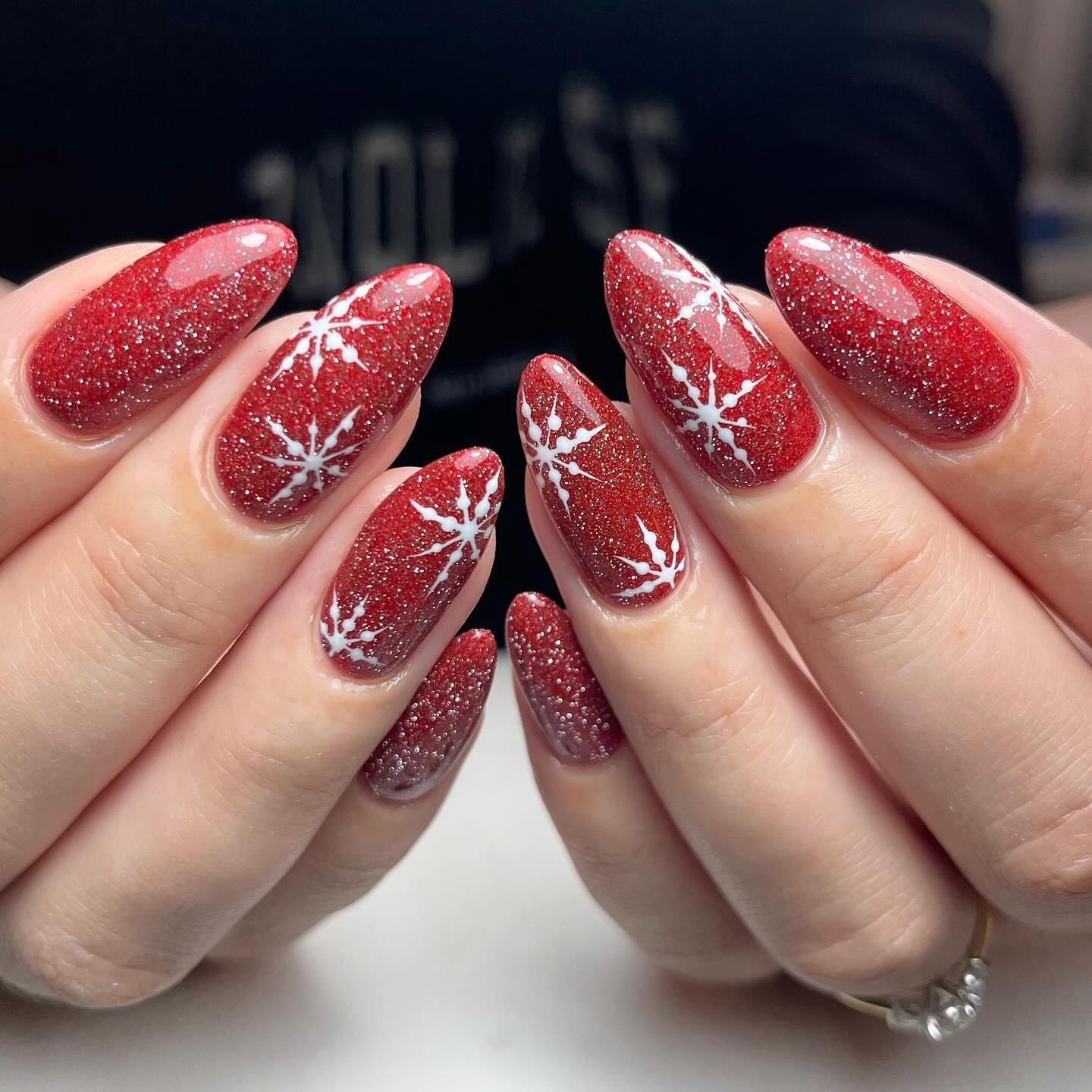 Sparkling Red Snowflake Almond Nails